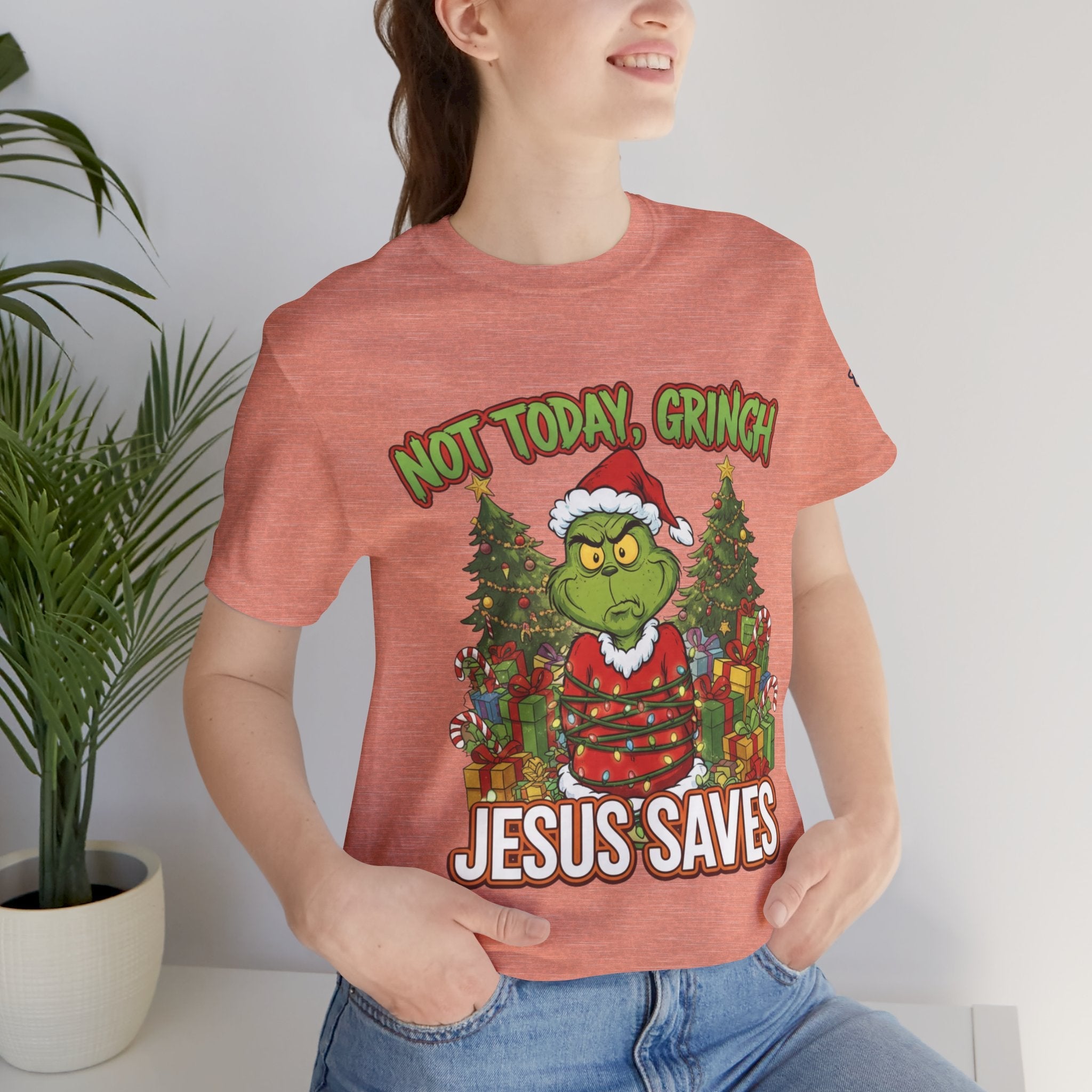 🎄 Not Today, Grinch – Jesus Saves | Funny Christian Christmas T-Shirt | Sulking Grinch & Glowing Cross | Bold Neon Faith Tee by Uplifted Gear Printify