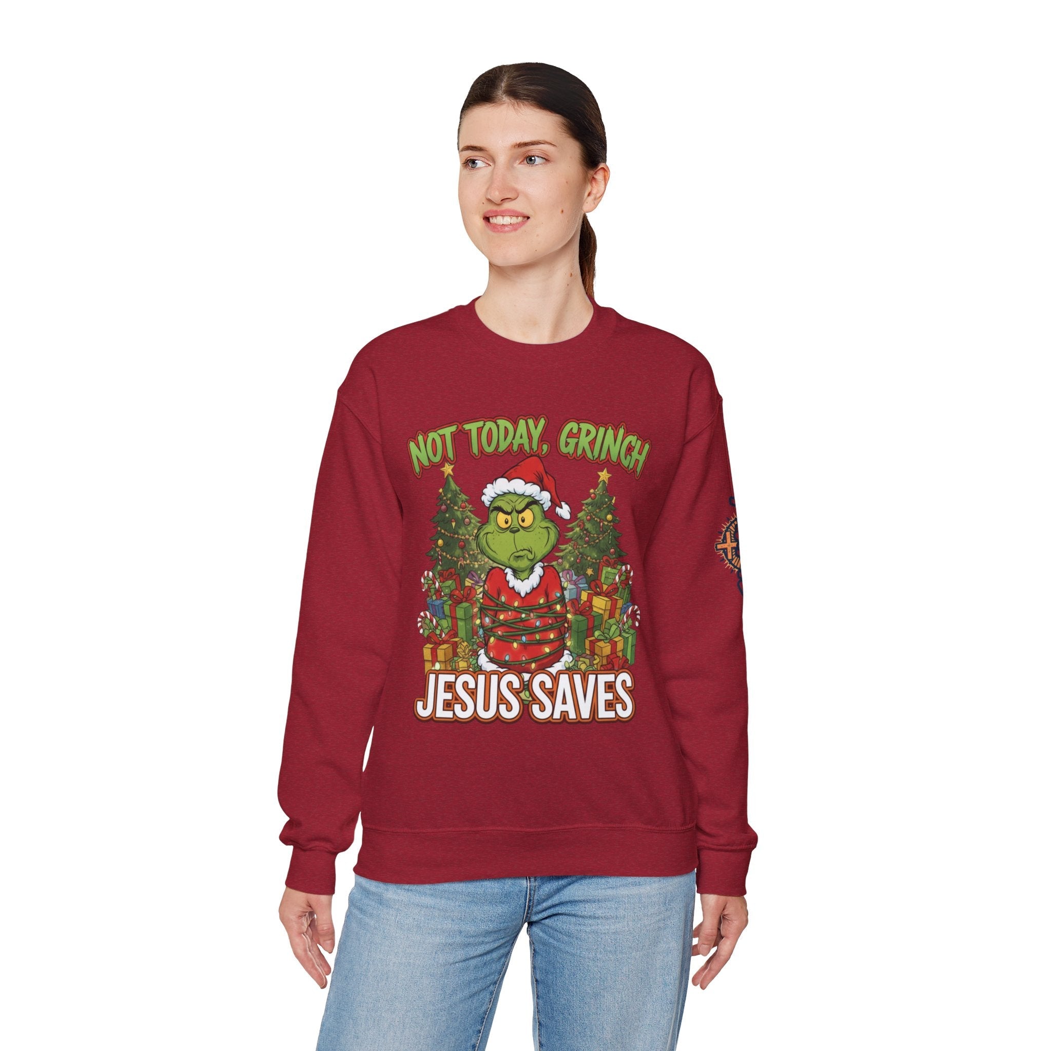🎄 Not Today, Grinch – Jesus Saves | Funny Christian Christmas Sweatshirt | Sulking Grinch & Glowing Cross | Bold Neon Faith Tee by Uplifted Gear Printify