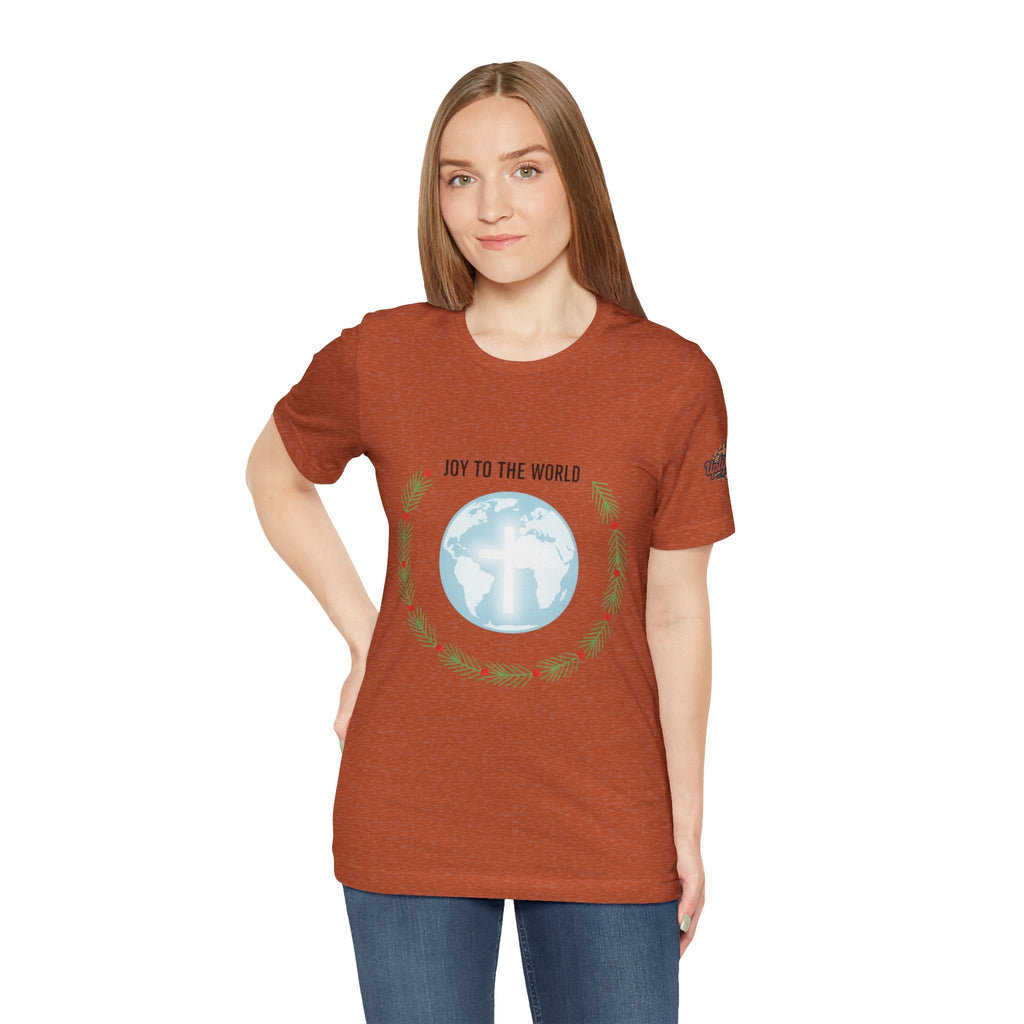 Joy to the World T-shirt – Wreath Earth Nativity Christian Christmas T-shirt for Isaiah 9:6 Holiday Faith & Festive Joy Printify