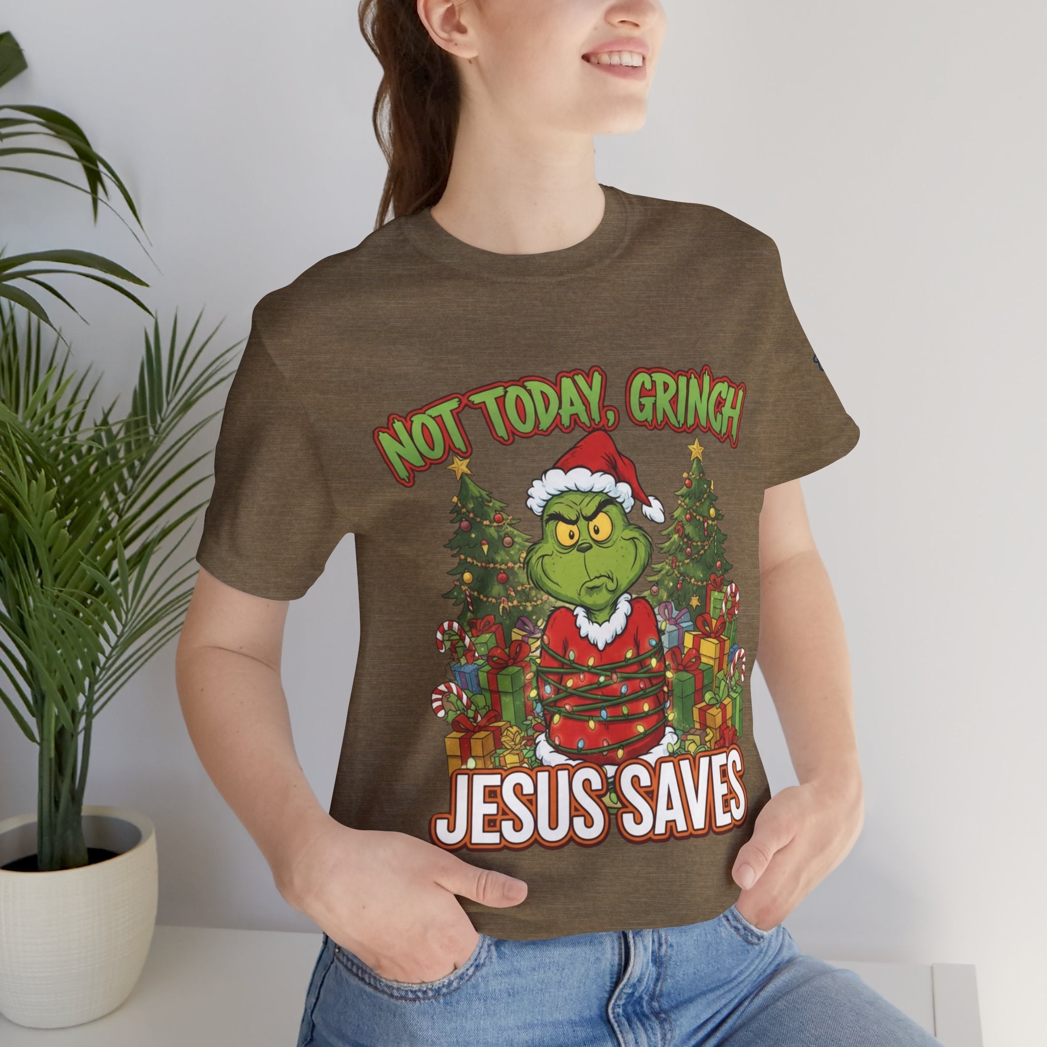 🎄 Not Today, Grinch – Jesus Saves | Funny Christian Christmas T-Shirt | Sulking Grinch & Glowing Cross | Bold Neon Faith Tee by Uplifted Gear Printify