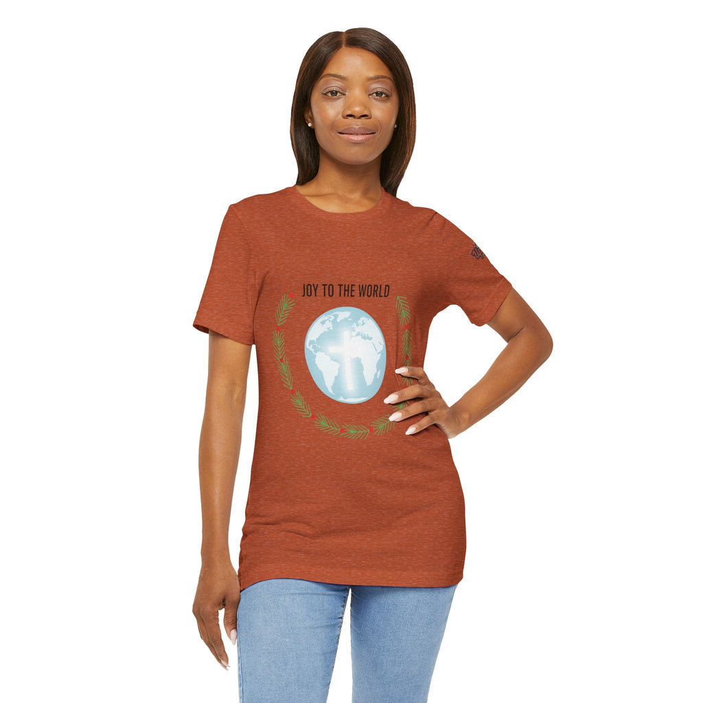 Joy to the World T-shirt – Wreath Earth Nativity Christian Christmas T-shirt for Isaiah 9:6 Holiday Faith & Festive Joy Printify