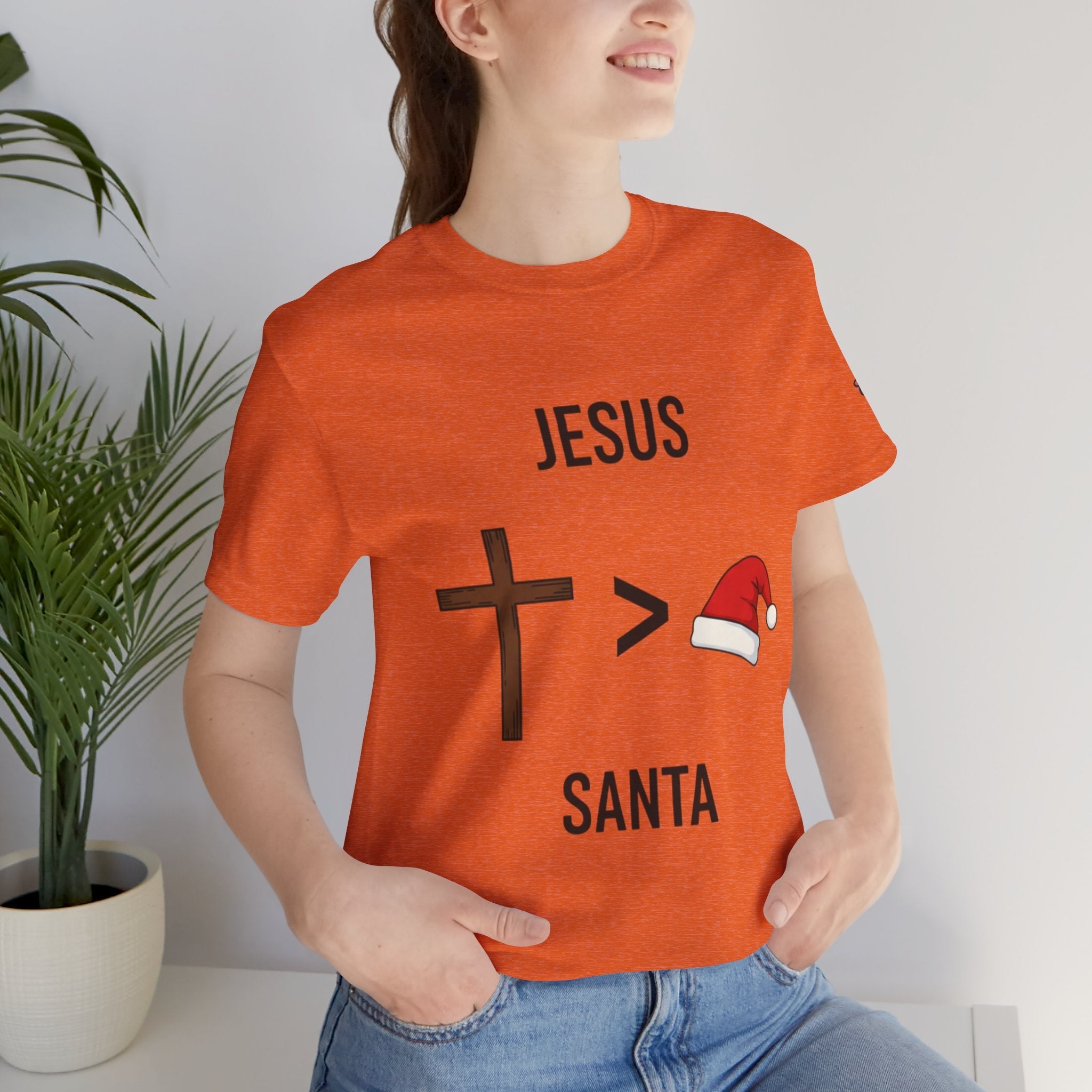 🎄 Jesus > Santa – Minimalist Christian Christmas T-Shirt | Bold Faith Over Holiday Tee | Cross vs Santa Hat Design | Uplifted Gear Printify
