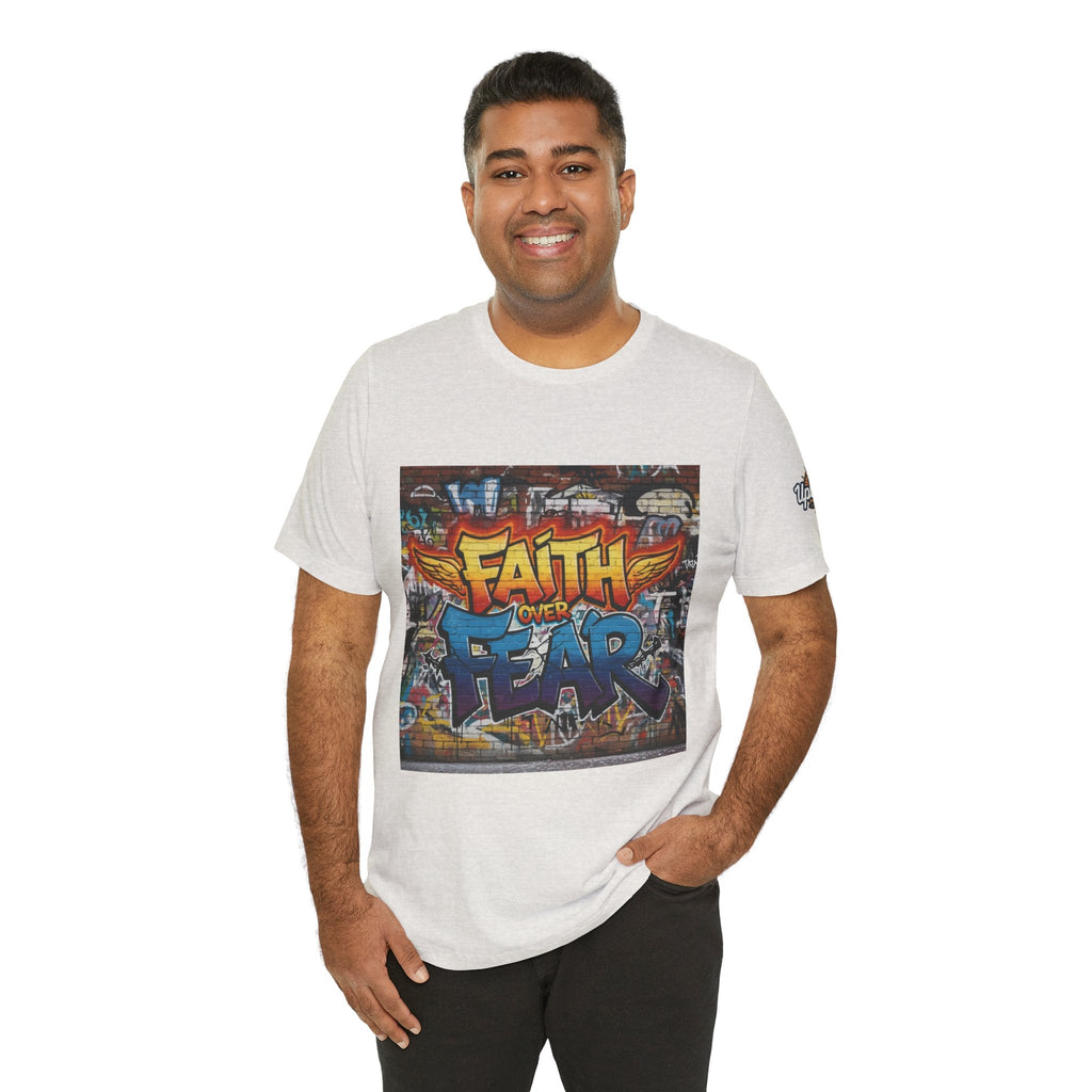 Faith Over Fear T-shirt – Graffiti Wall Christian T-shirt for Bold 2 Corinthians 5:7 Streetwear & Unshakable Faith Printify