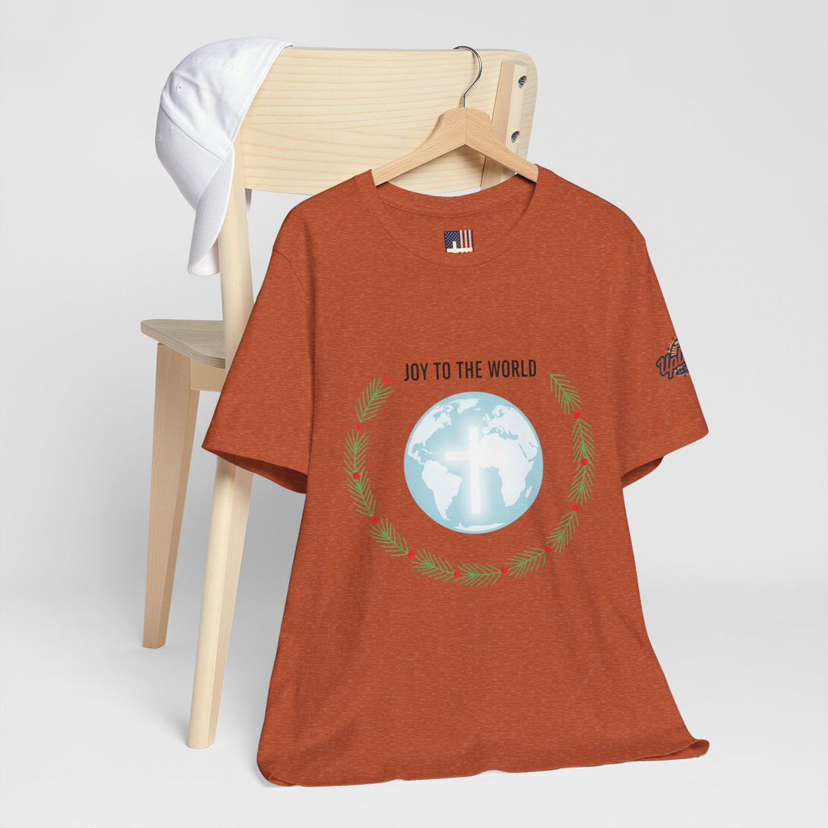 Joy to the World T-shirt – Wreath Earth Nativity Christian Christmas T-shirt for Isaiah 9:6 Holiday Faith & Festive Joy Printify
