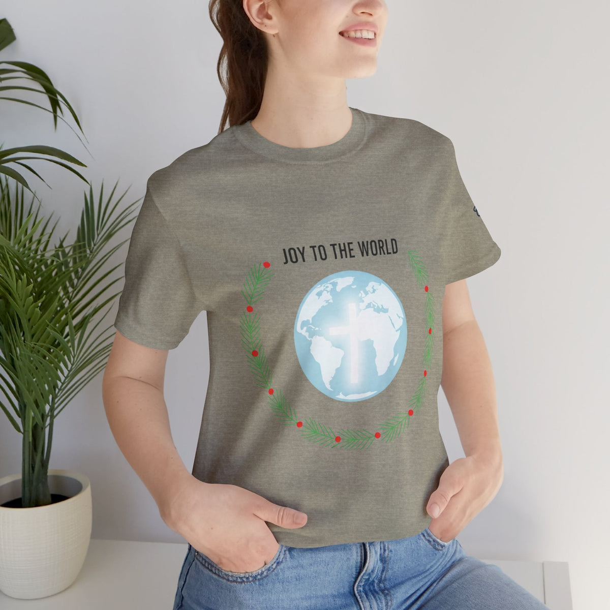 Joy to the World T-shirt – Wreath Earth Nativity Christian Christmas T-shirt for Isaiah 9:6 Holiday Faith & Festive Joy Printify