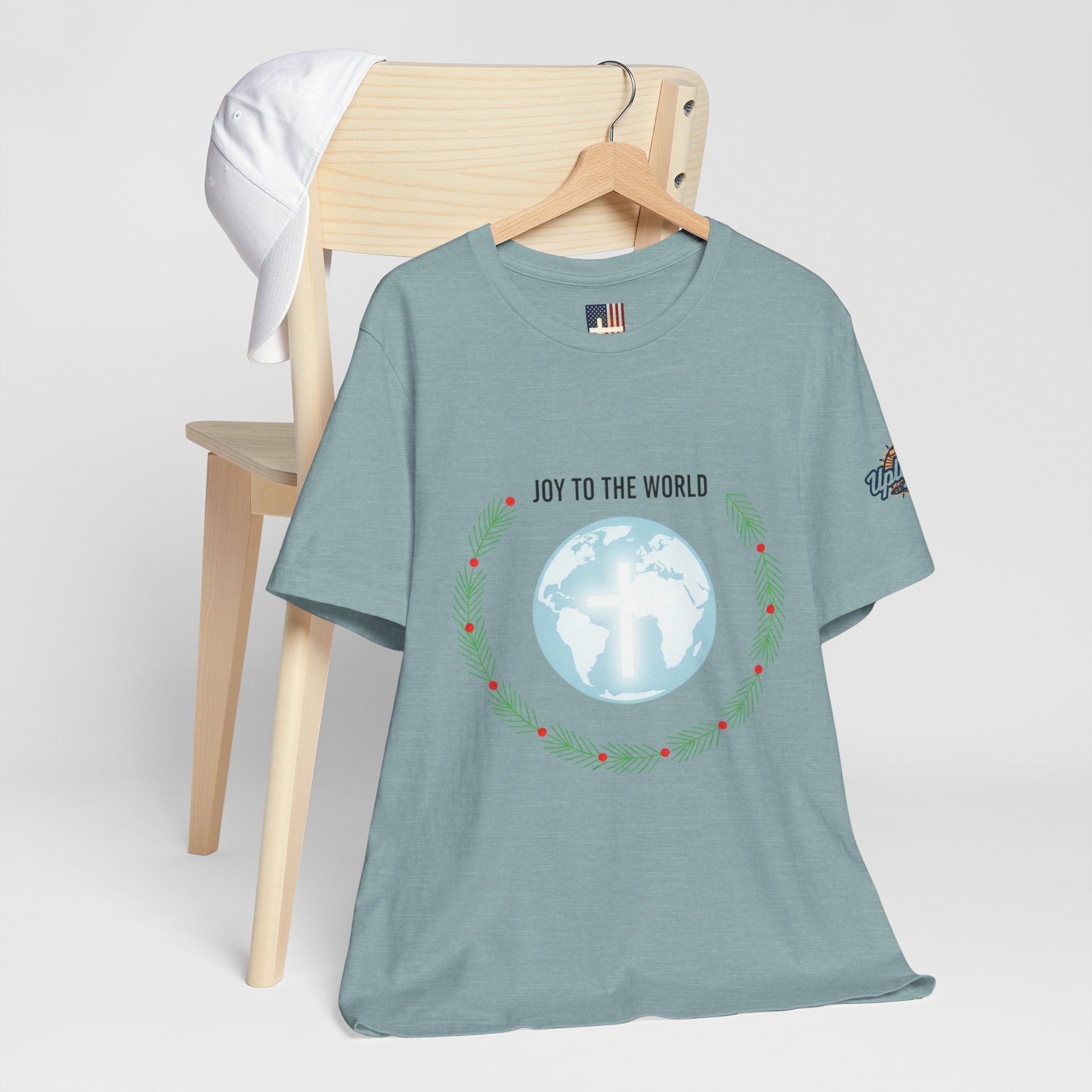 Joy to the World T-shirt – Wreath Earth Nativity Christian Christmas T-shirt for Isaiah 9:6 Holiday Faith & Festive Joy Printify