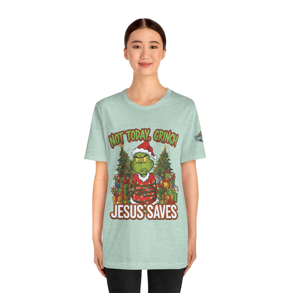 🎄 Not Today, Grinch – Jesus Saves | Funny Christian Christmas T-Shirt | Sulking Grinch & Glowing Cross | Bold Neon Faith Tee by Uplifted Gear Printify