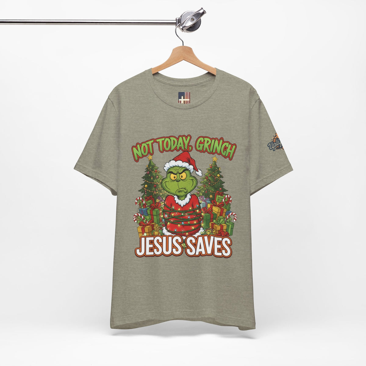 🎄 Not Today, Grinch – Jesus Saves | Funny Christian Christmas T-Shirt | Sulking Grinch & Glowing Cross | Bold Neon Faith Tee by Uplifted Gear Printify