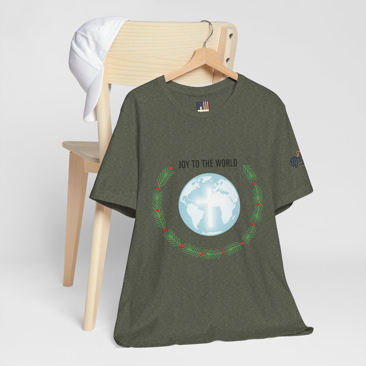 Joy to the World T-shirt – Wreath Earth Nativity Christian Christmas T-shirt for Isaiah 9:6 Holiday Faith & Festive Joy Printify