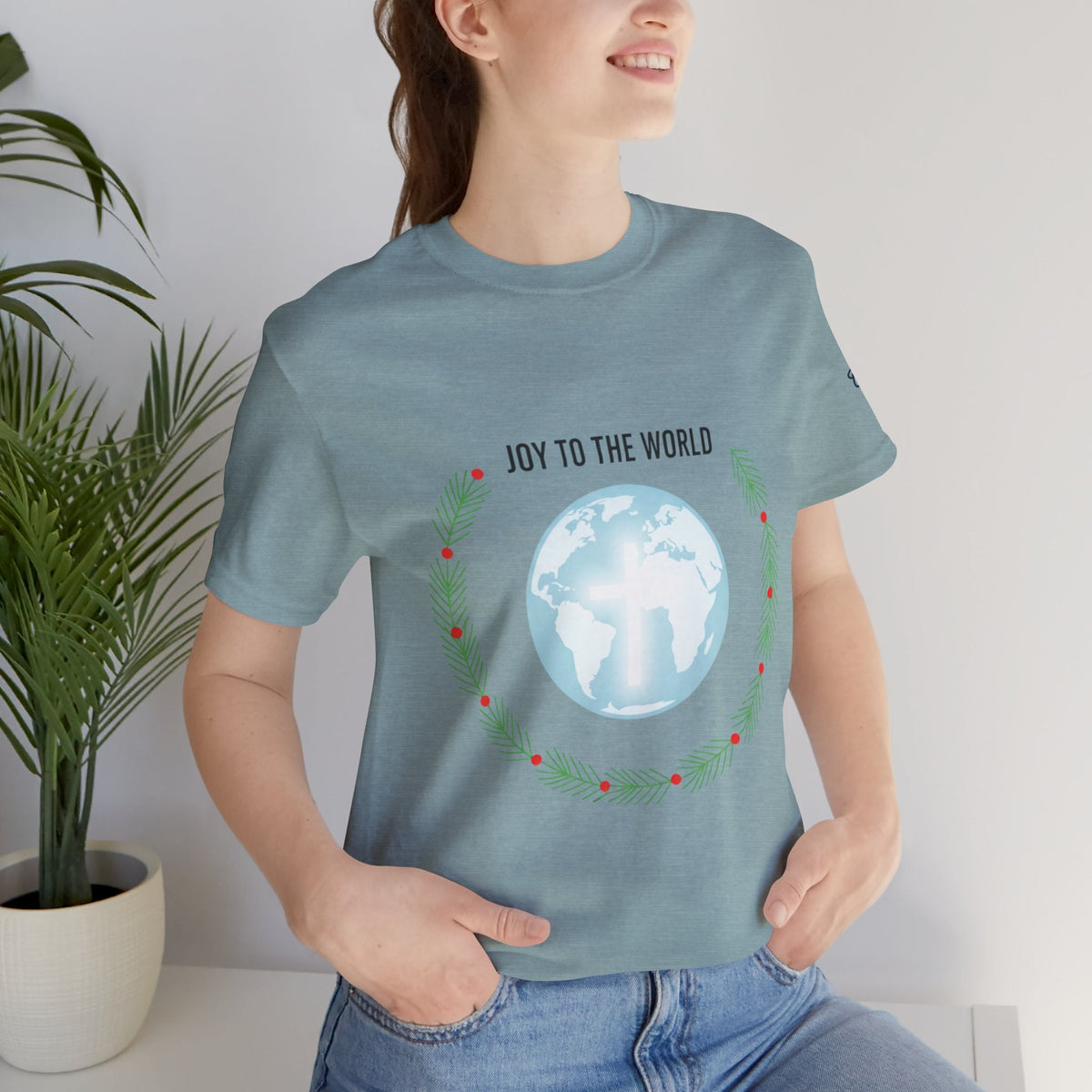 Joy to the World T-shirt – Wreath Earth Nativity Christian Christmas T-shirt for Isaiah 9:6 Holiday Faith & Festive Joy Printify