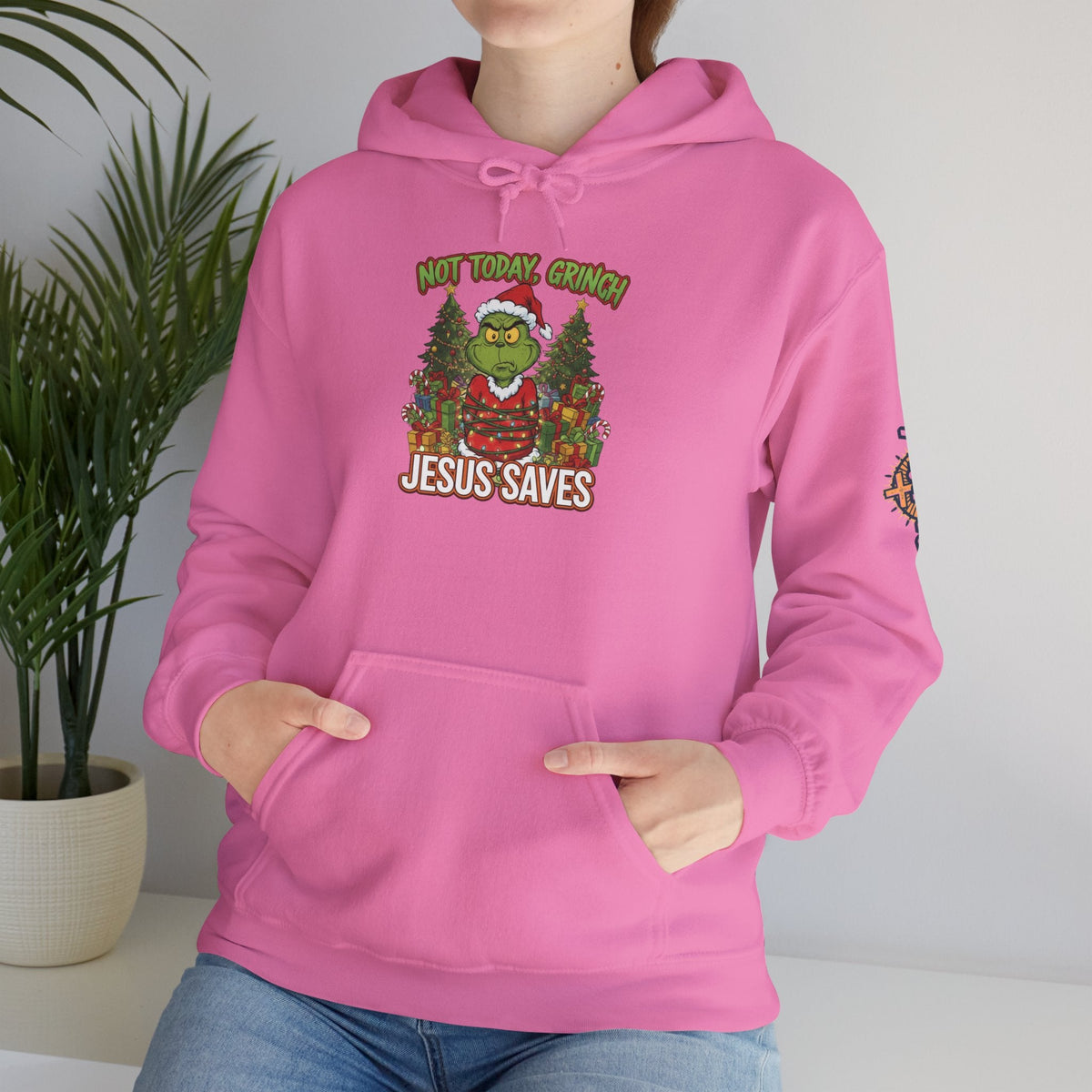 🎄 Not Today, Grinch – Jesus Saves | Funny Christian Christmas Hoodie | Sulking Grinch & Glowing Cross | Bold Neon Faith Tee by Uplifted Gear Printify