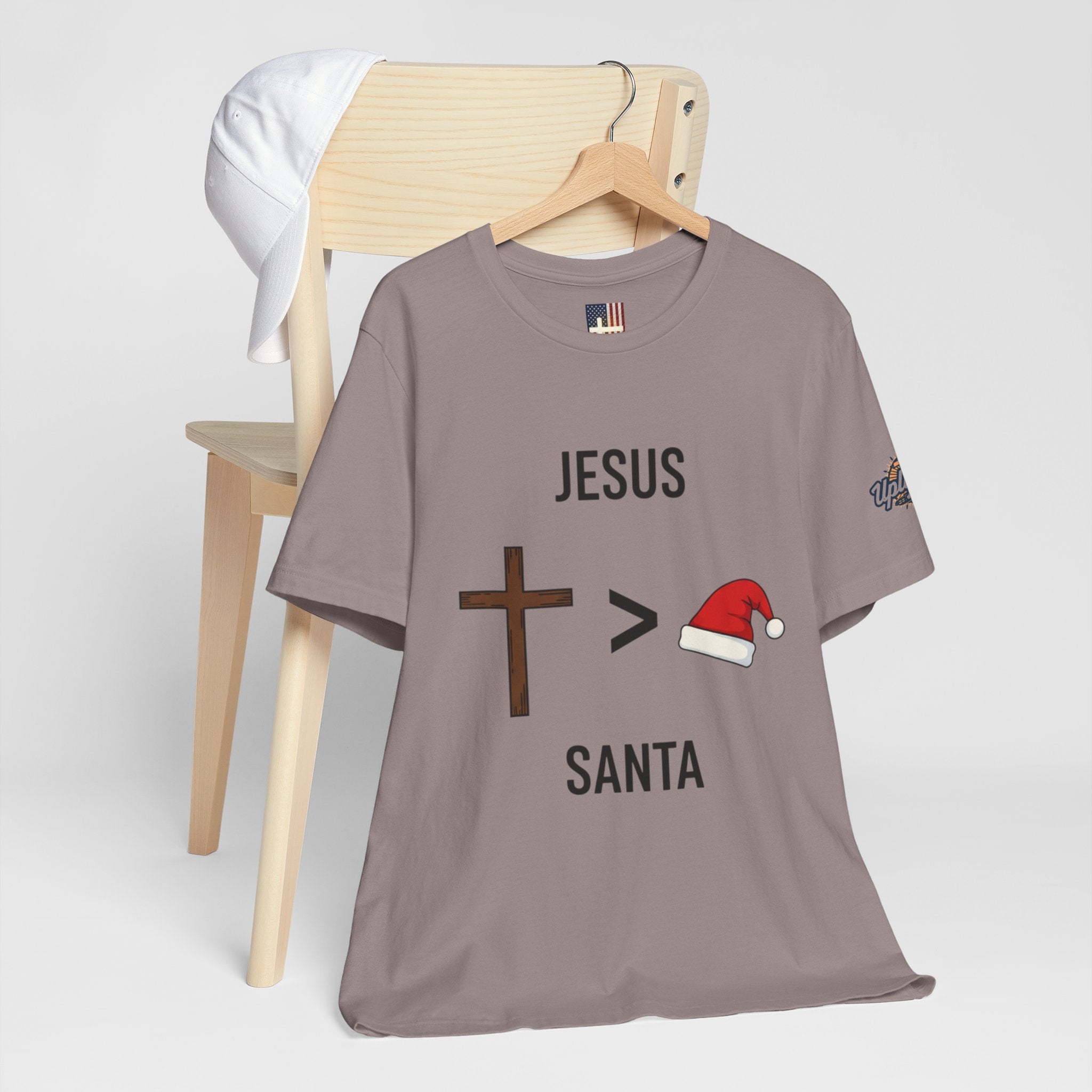🎄 Jesus > Santa – Minimalist Christian Christmas T-Shirt | Bold Faith Over Holiday Tee | Cross vs Santa Hat Design | Uplifted Gear Printify