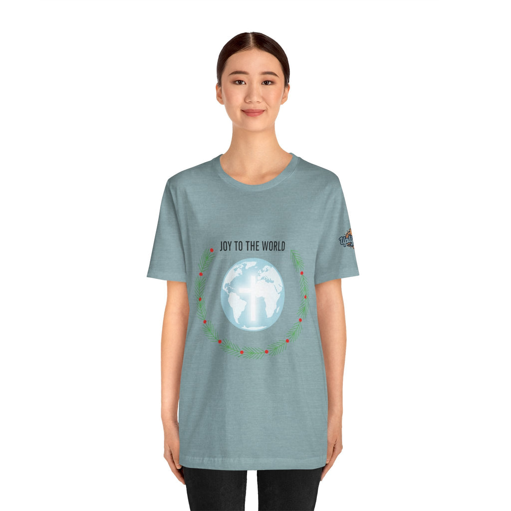 Joy to the World T-shirt – Wreath Earth Nativity Christian Christmas T-shirt for Isaiah 9:6 Holiday Faith & Festive Joy Printify