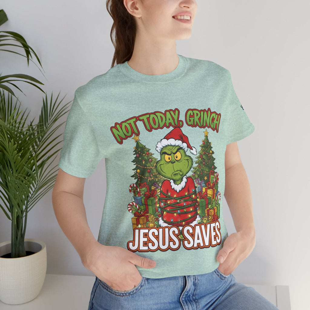 🎄 Not Today, Grinch – Jesus Saves | Funny Christian Christmas T-Shirt | Sulking Grinch & Glowing Cross | Bold Neon Faith Tee by Uplifted Gear Printify