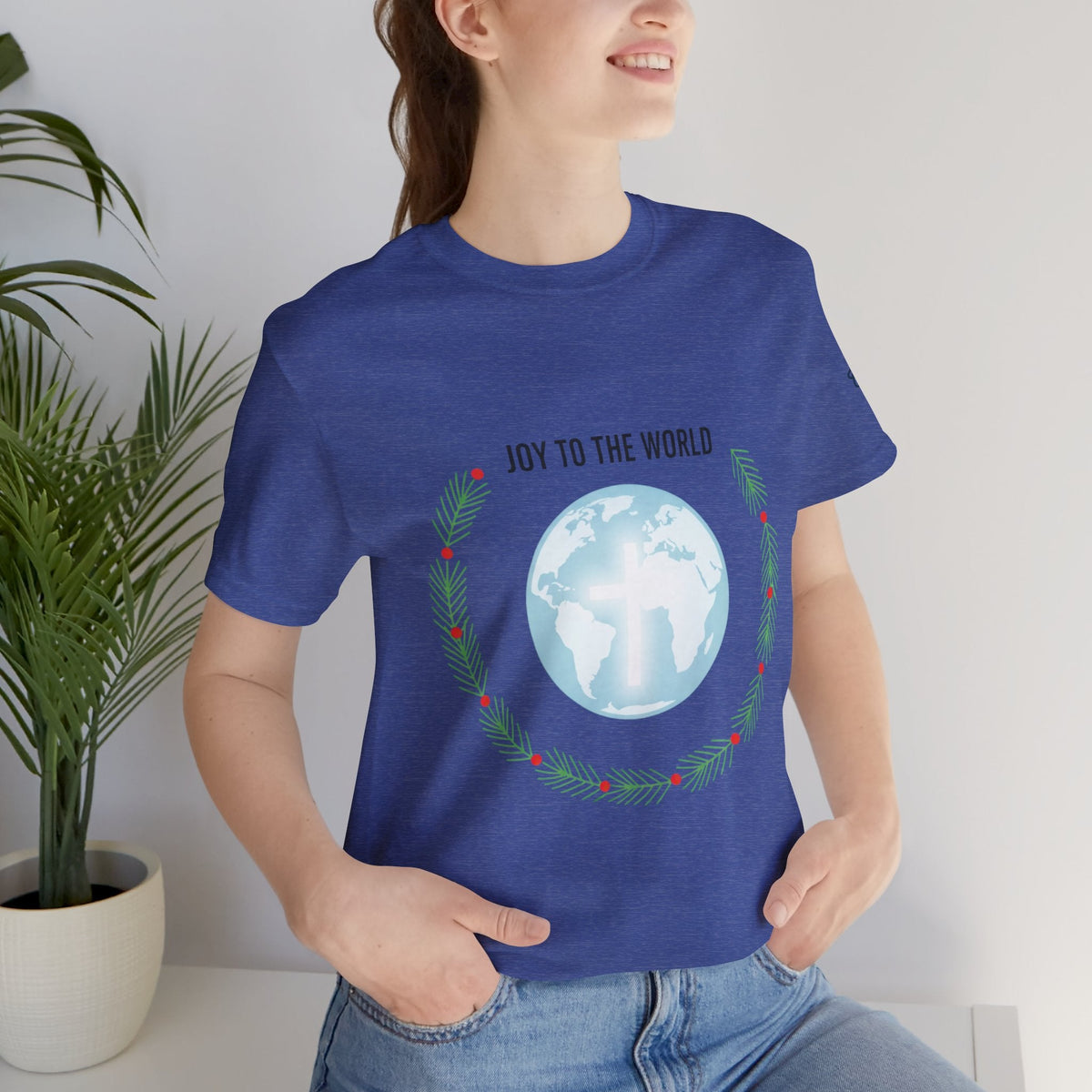 Joy to the World T-shirt – Wreath Earth Nativity Christian Christmas T-shirt for Isaiah 9:6 Holiday Faith & Festive Joy Printify