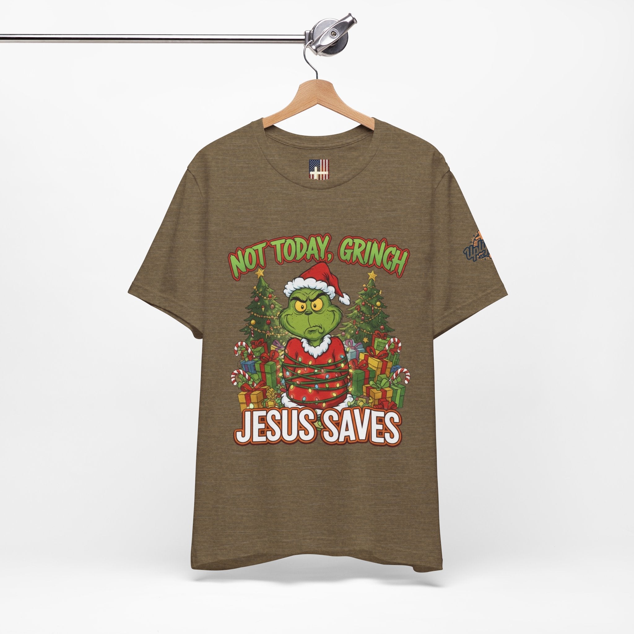 🎄 Not Today, Grinch – Jesus Saves | Funny Christian Christmas T-Shirt | Sulking Grinch & Glowing Cross | Bold Neon Faith Tee by Uplifted Gear Printify