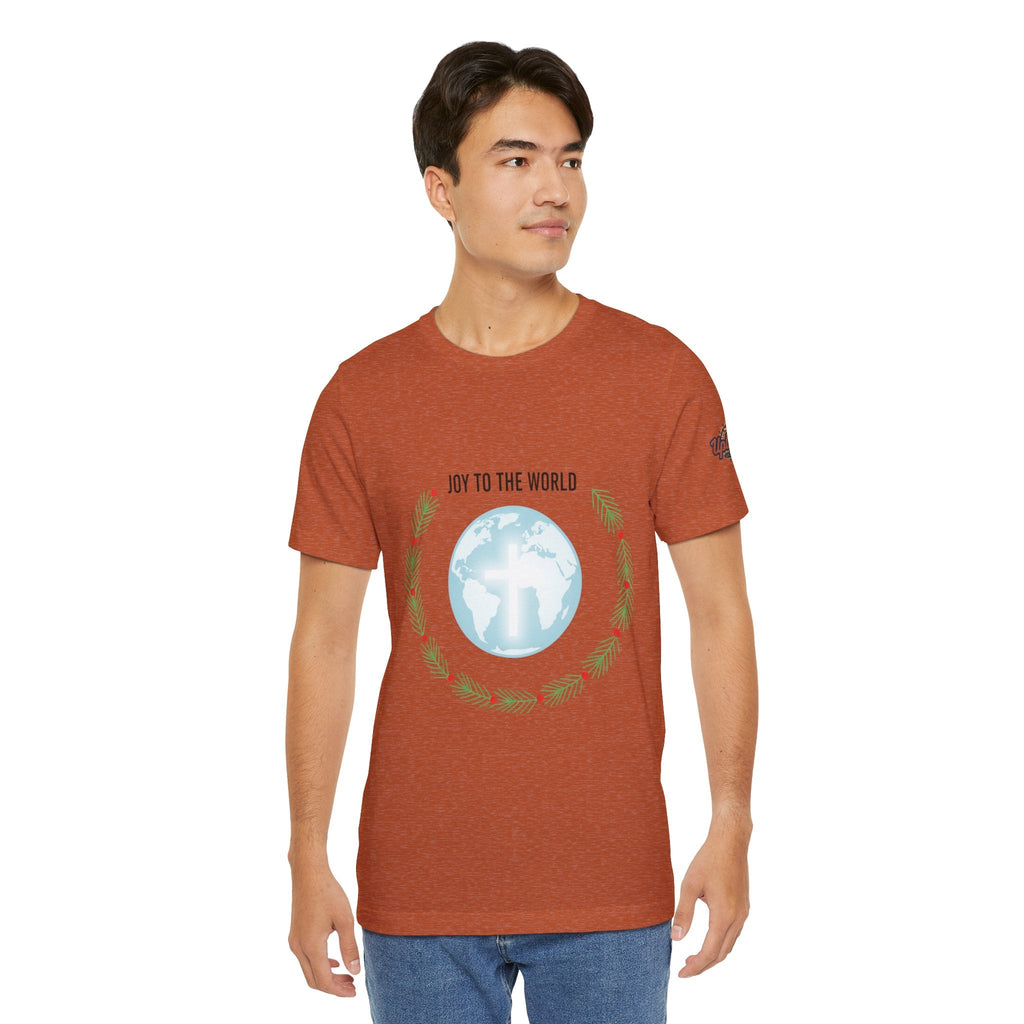 Joy to the World T-shirt – Wreath Earth Nativity Christian Christmas T-shirt for Isaiah 9:6 Holiday Faith & Festive Joy Printify