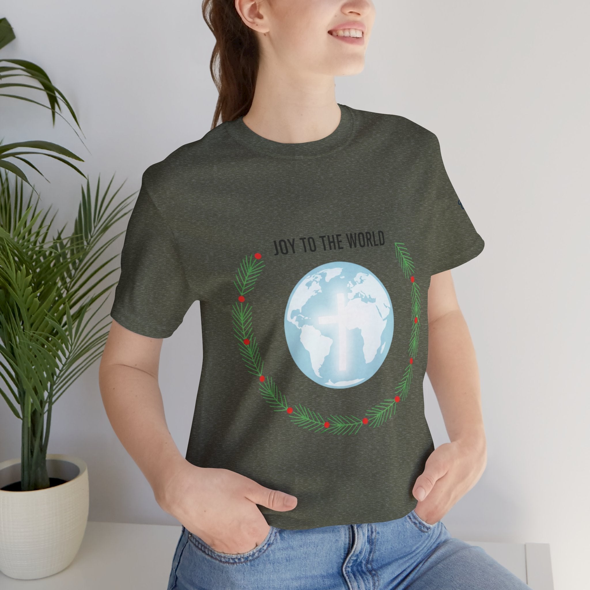 Joy to the World T-shirt – Wreath Earth Nativity Christian Christmas T-shirt for Isaiah 9:6 Holiday Faith & Festive Joy Printify