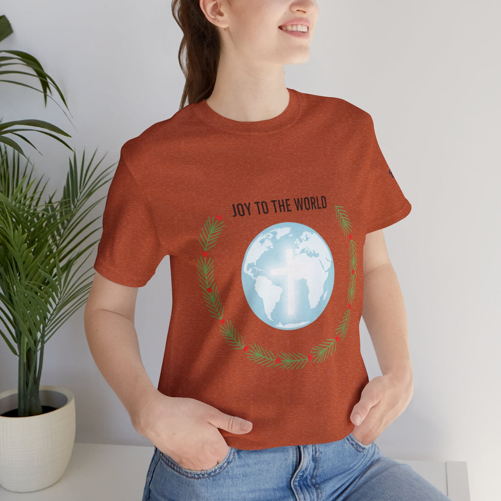 Joy to the World T-shirt – Wreath Earth Nativity Christian Christmas T-shirt for Isaiah 9:6 Holiday Faith & Festive Joy Printify
