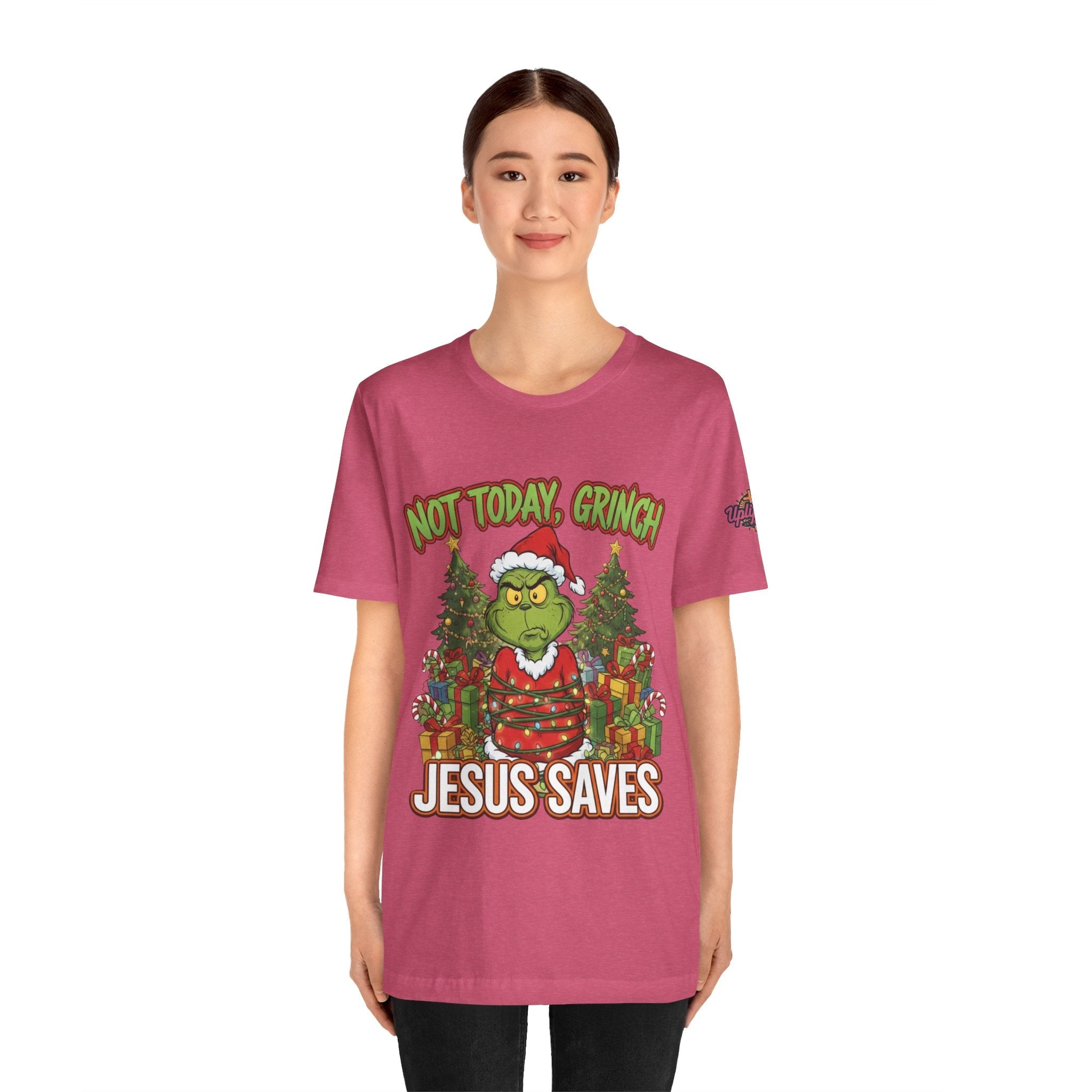 🎄 Not Today, Grinch – Jesus Saves | Funny Christian Christmas T-Shirt | Sulking Grinch & Glowing Cross | Bold Neon Faith Tee by Uplifted Gear Printify