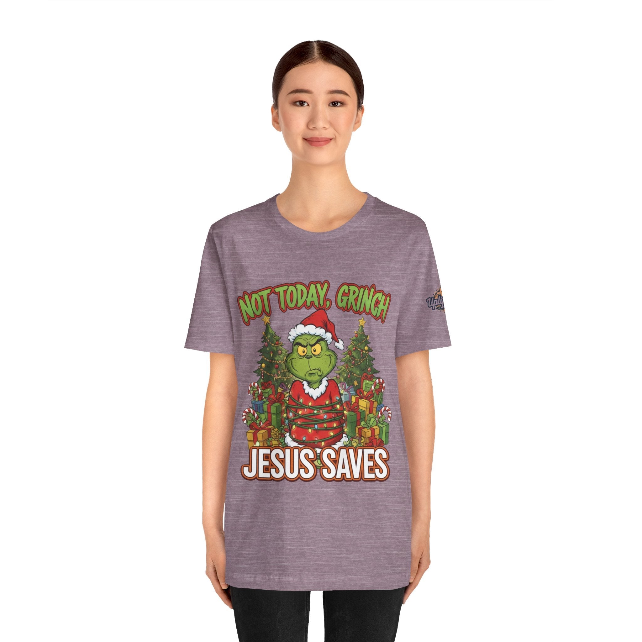 🎄 Not Today, Grinch – Jesus Saves | Funny Christian Christmas T-Shirt | Sulking Grinch & Glowing Cross | Bold Neon Faith Tee by Uplifted Gear Printify