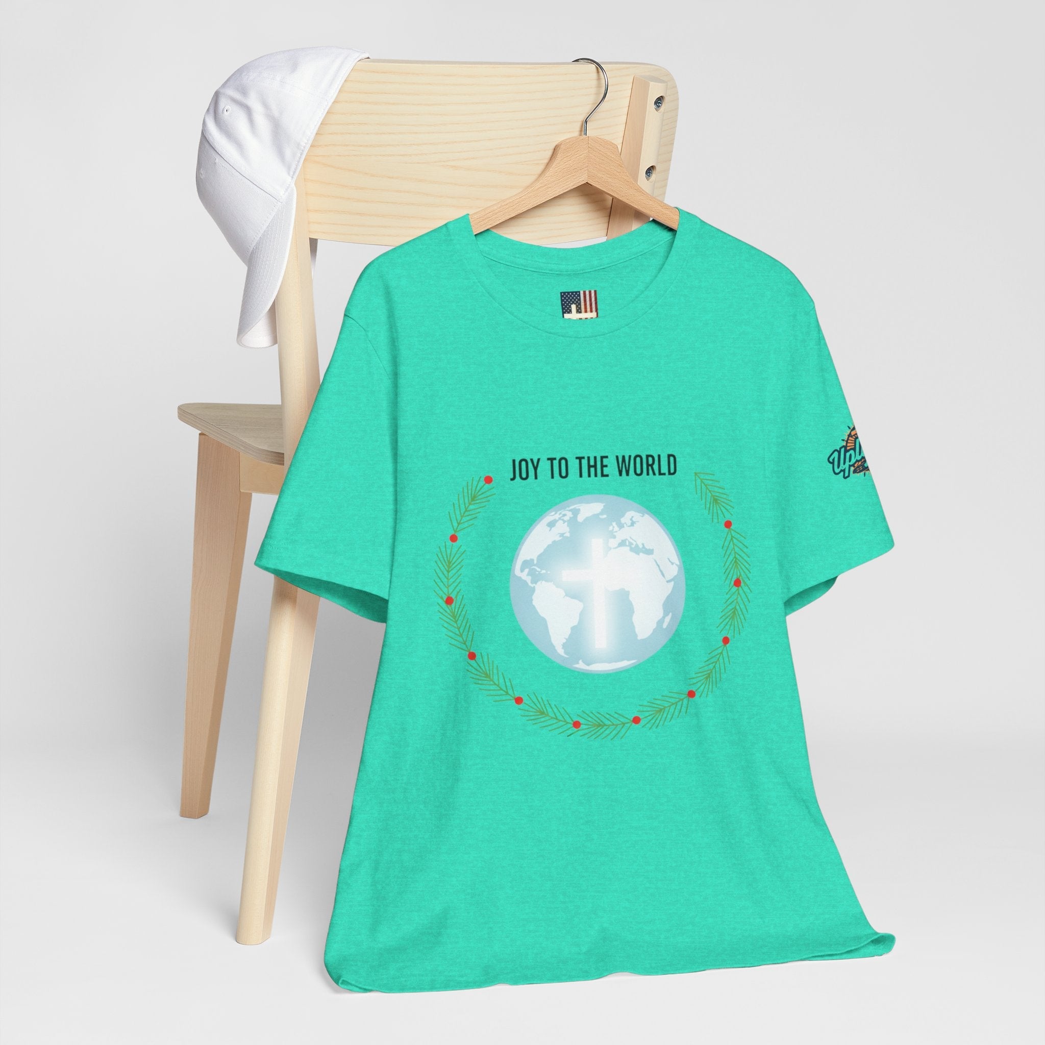 Joy to the World T-shirt – Wreath Earth Nativity Christian Christmas T-shirt for Isaiah 9:6 Holiday Faith & Festive Joy Printify