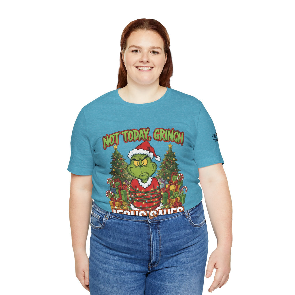 🎄 Not Today, Grinch – Jesus Saves | Funny Christian Christmas T-Shirt | Sulking Grinch & Glowing Cross | Bold Neon Faith Tee by Uplifted Gear Printify