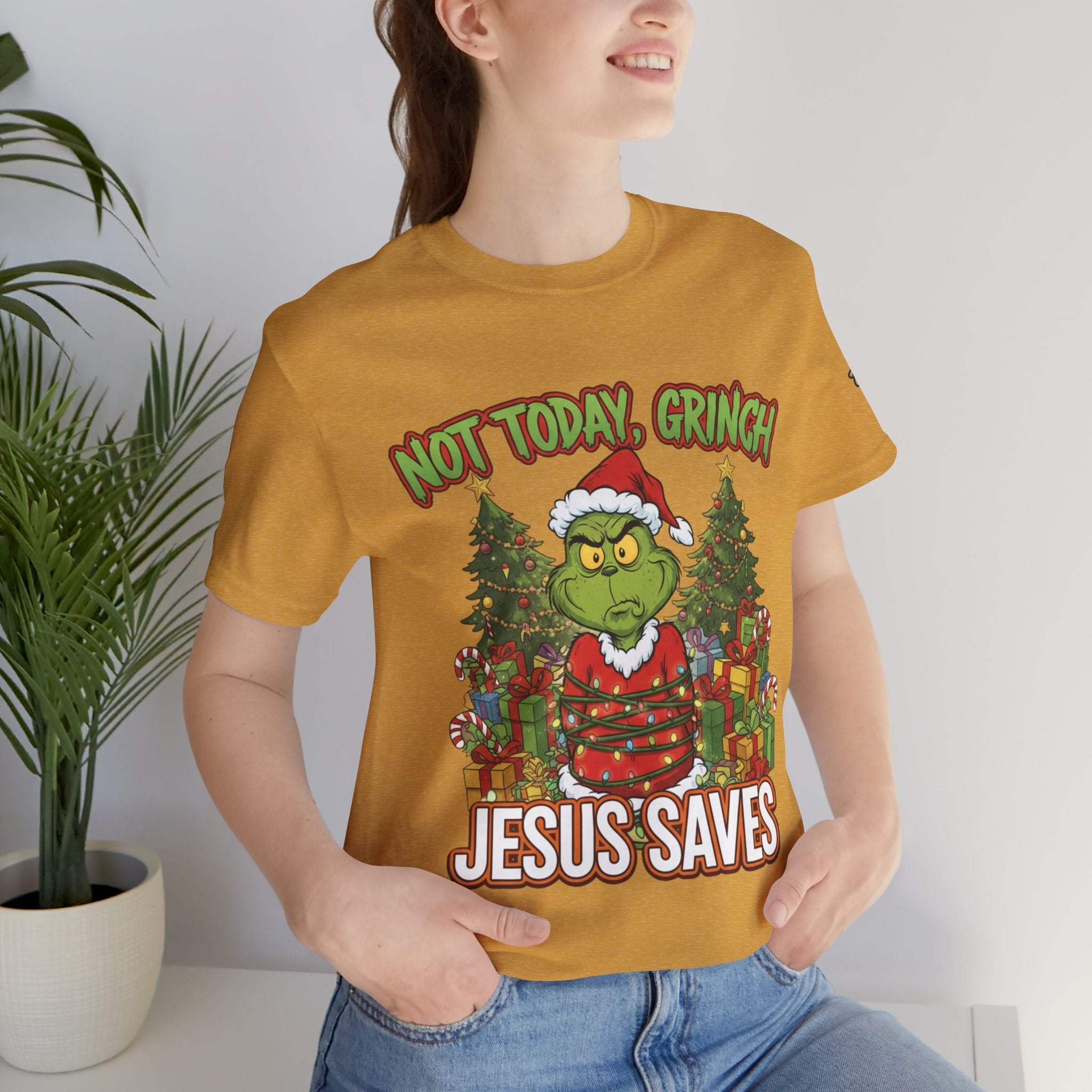 🎄 Not Today, Grinch – Jesus Saves | Funny Christian Christmas T-Shirt | Sulking Grinch & Glowing Cross | Bold Neon Faith Tee by Uplifted Gear Printify