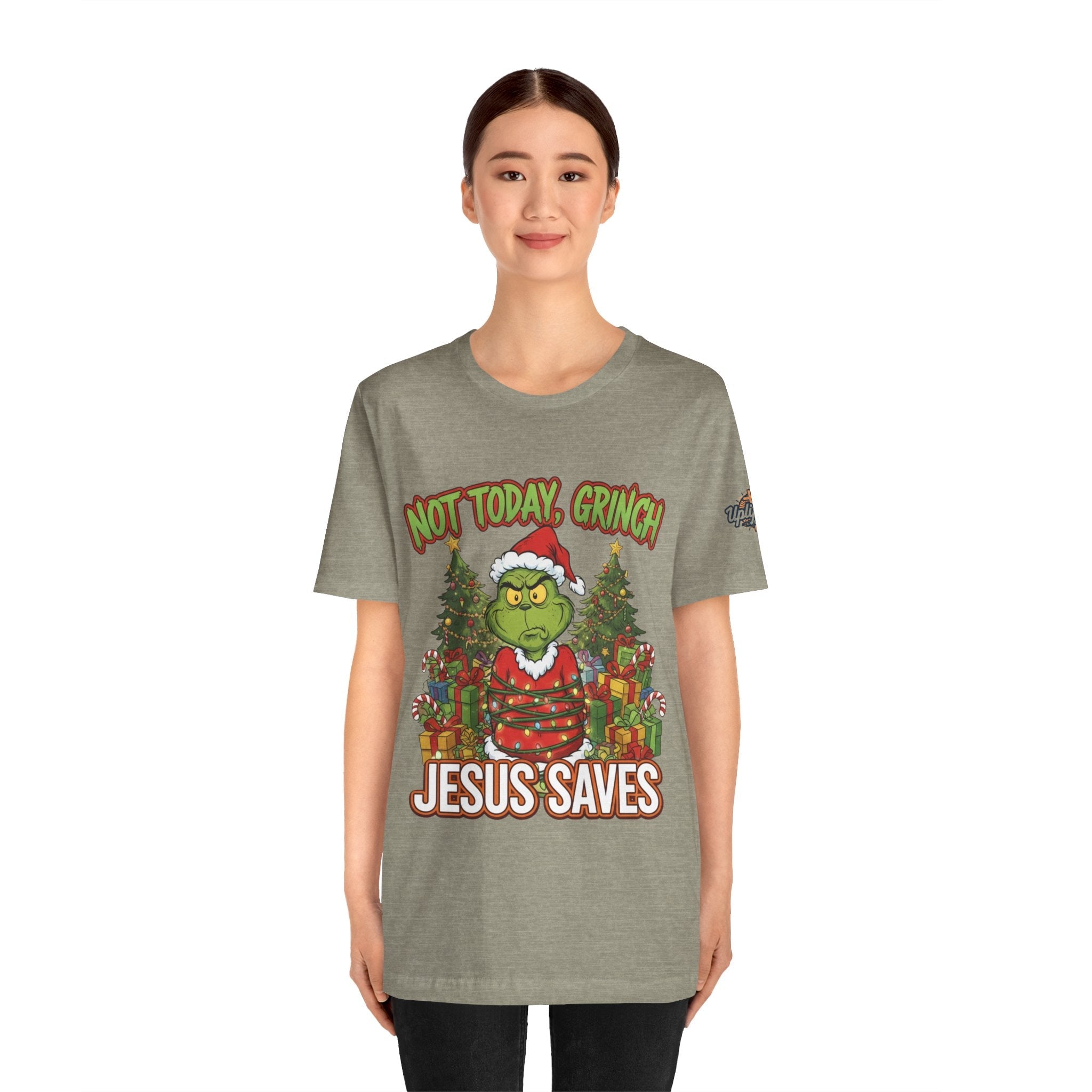 🎄 Not Today, Grinch – Jesus Saves | Funny Christian Christmas T-Shirt | Sulking Grinch & Glowing Cross | Bold Neon Faith Tee by Uplifted Gear Printify