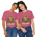 🎄 Not Today, Grinch – Jesus Saves | Funny Christian Christmas T-Shirt | Sulking Grinch & Glowing Cross | Bold Neon Faith Tee by Uplifted Gear Printify