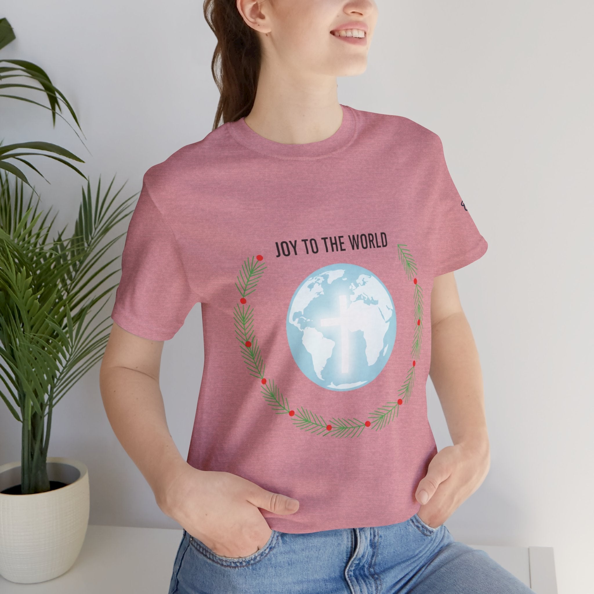 Joy to the World T-shirt – Wreath Earth Nativity Christian Christmas T-shirt for Isaiah 9:6 Holiday Faith & Festive Joy Printify