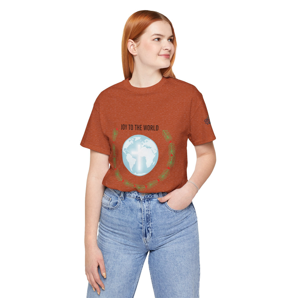 Joy to the World T-shirt – Wreath Earth Nativity Christian Christmas T-shirt for Isaiah 9:6 Holiday Faith & Festive Joy Printify