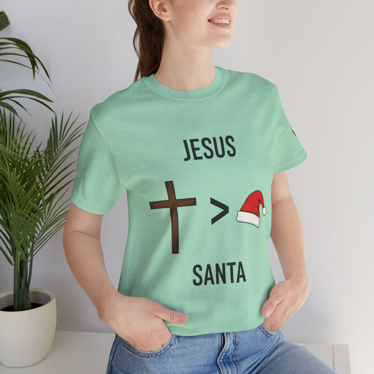 🎄 Jesus > Santa – Minimalist Christian Christmas T-Shirt | Bold Faith Over Holiday Tee | Cross vs Santa Hat Design | Uplifted Gear Printify