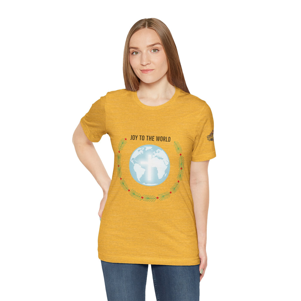 Joy to the World T-shirt – Wreath Earth Nativity Christian Christmas T-shirt for Isaiah 9:6 Holiday Faith & Festive Joy Printify