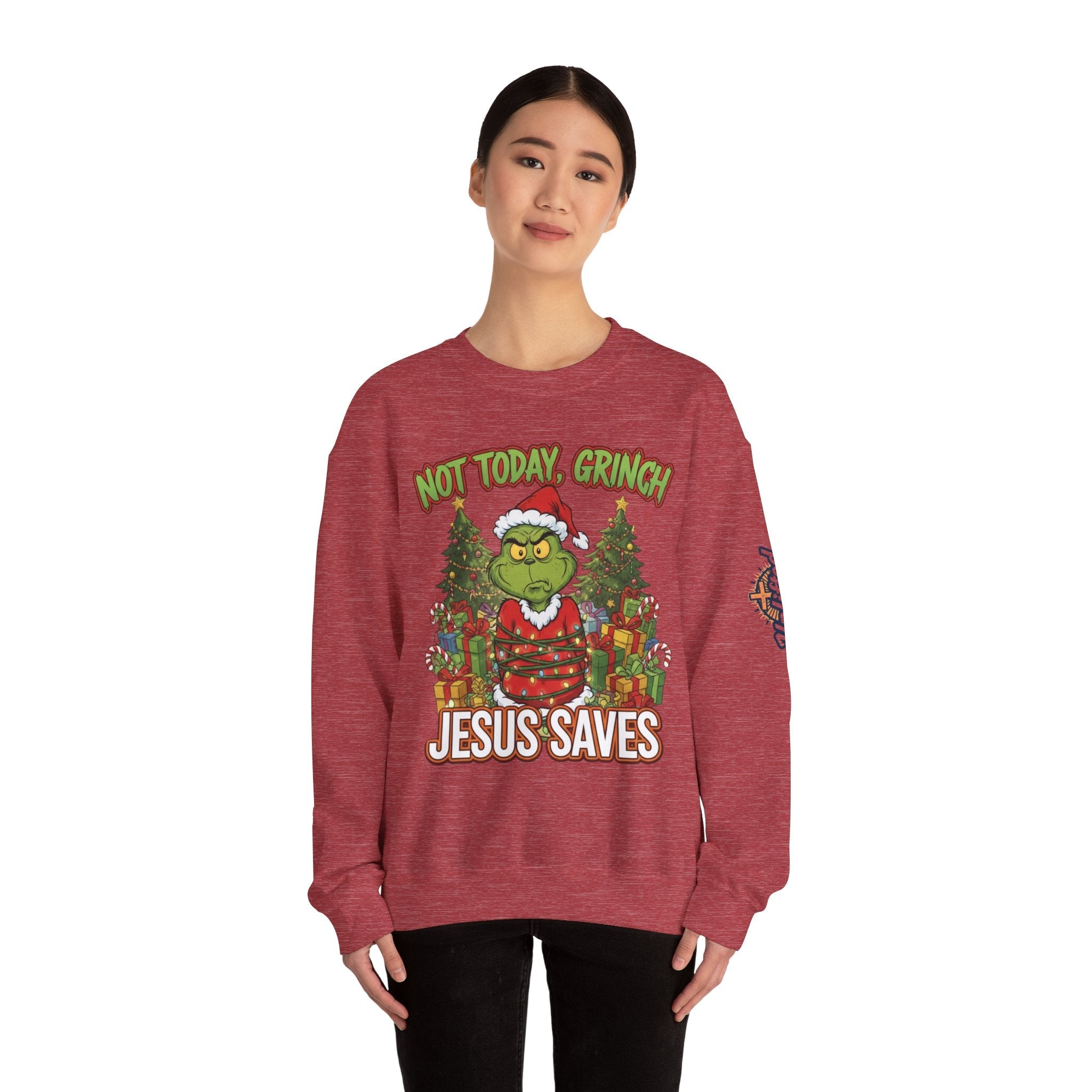 🎄 Not Today, Grinch – Jesus Saves | Funny Christian Christmas Sweatshirt | Sulking Grinch & Glowing Cross | Bold Neon Faith Tee by Uplifted Gear Printify