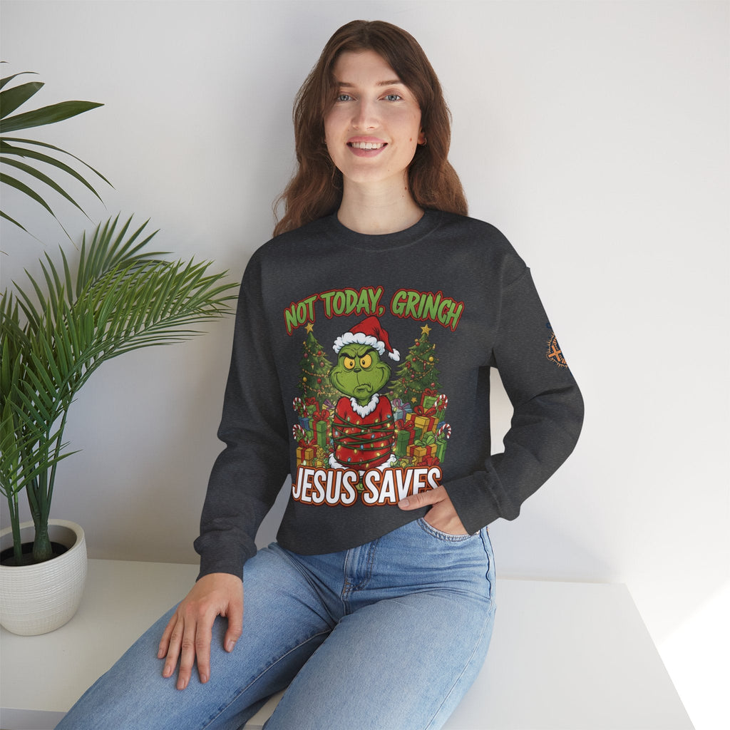 🎄 Not Today, Grinch – Jesus Saves | Funny Christian Christmas Sweatshirt | Sulking Grinch & Glowing Cross | Bold Neon Faith Tee by Uplifted Gear Printify