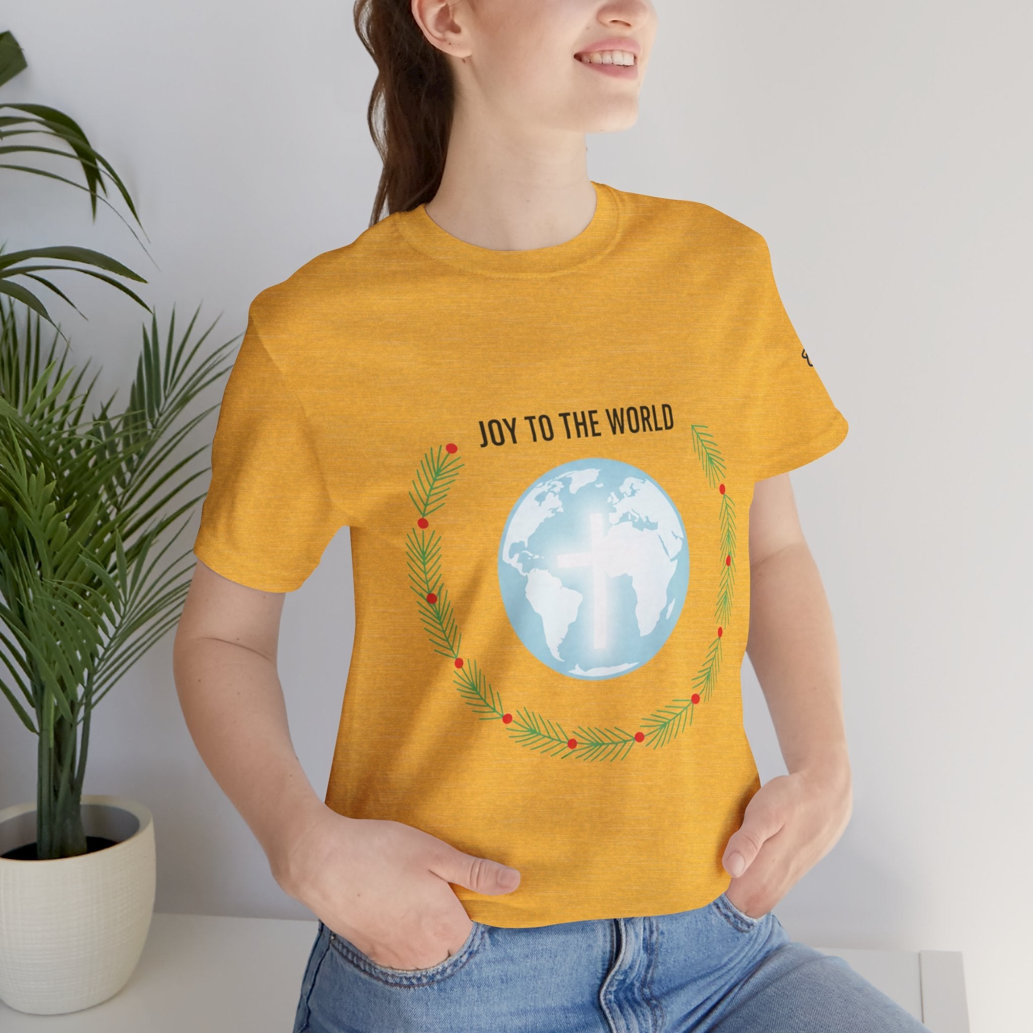 Joy to the World T-shirt – Wreath Earth Nativity Christian Christmas T-shirt for Isaiah 9:6 Holiday Faith & Festive Joy Printify